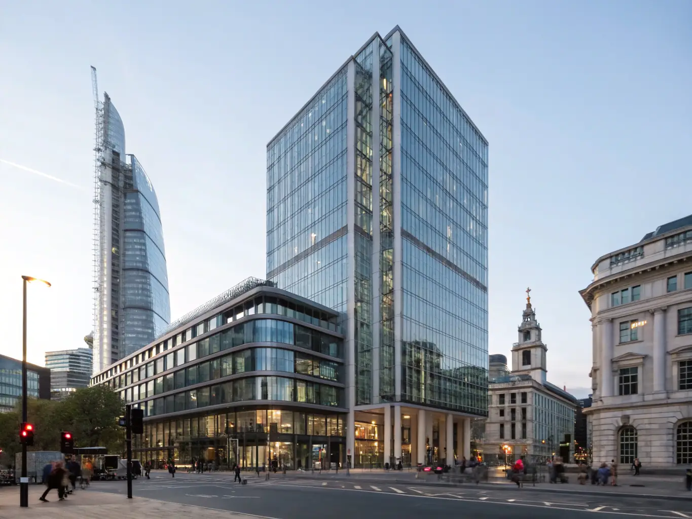 A modern office building in London, UK, with a focus on the entrance and signage.